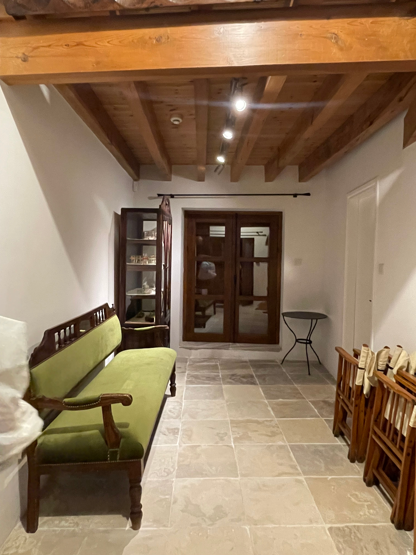 The sitting area beneath the timber ceiling